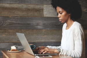 woman on a computer in a coffee shop